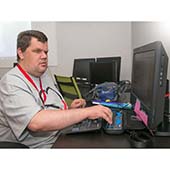 man using computer with accessibility tools