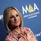 Marlee Matlin wearing pink on the MAA red carpet  step and repeat.