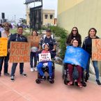 A photo of participants at the Van Nuys State Building during a rally.