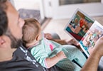 Man reading to baby
