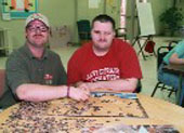 Brandon, an Easter Seals client, working on a puzzle