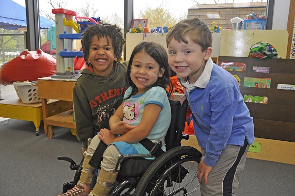 Children with girl in wheelchair